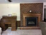 The rec room has a fireplace.