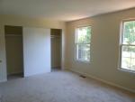The master bedroom has two closets and a doorway into the hall bath.