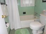 This is the pretty green bathroom on the main level between the living room and the kitchen.